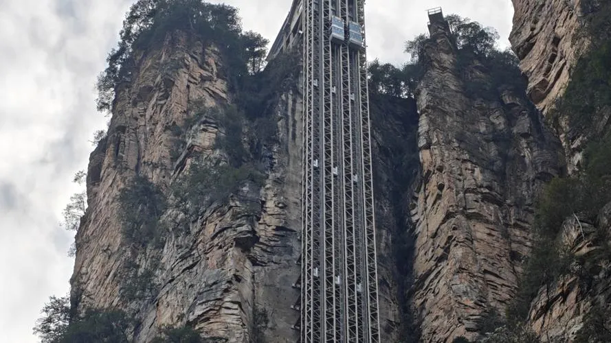 The Bailong Elevator against the karst pillars