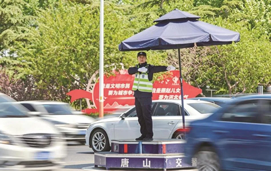 A traffic officer at a daytime intersection