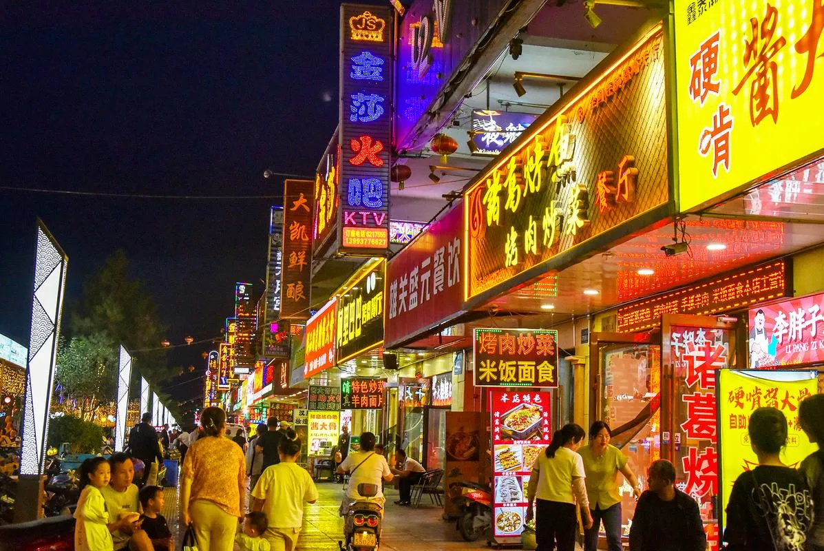 A lit and busy Chinese night street