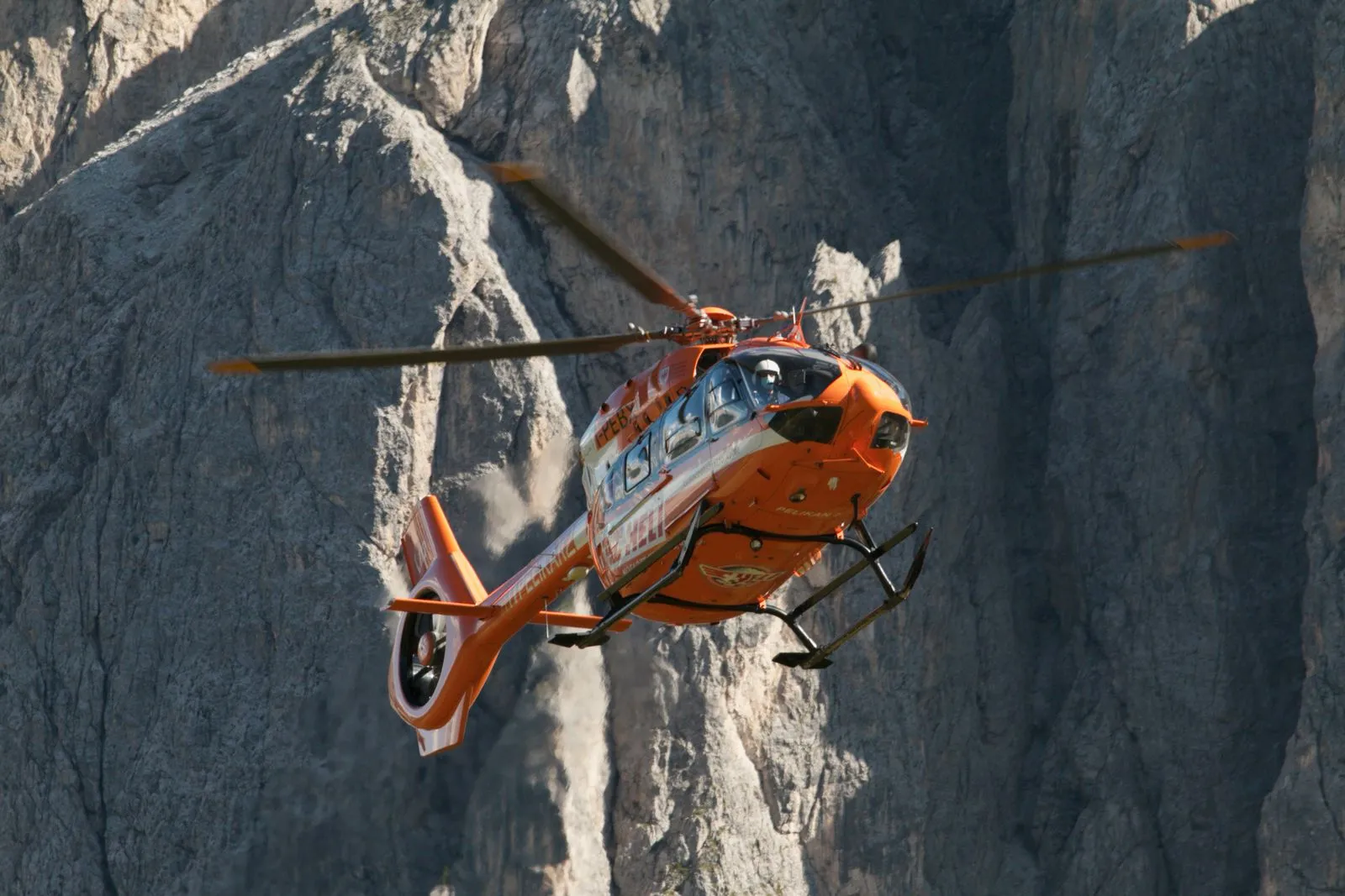 Mountain rescue helicopter in flight