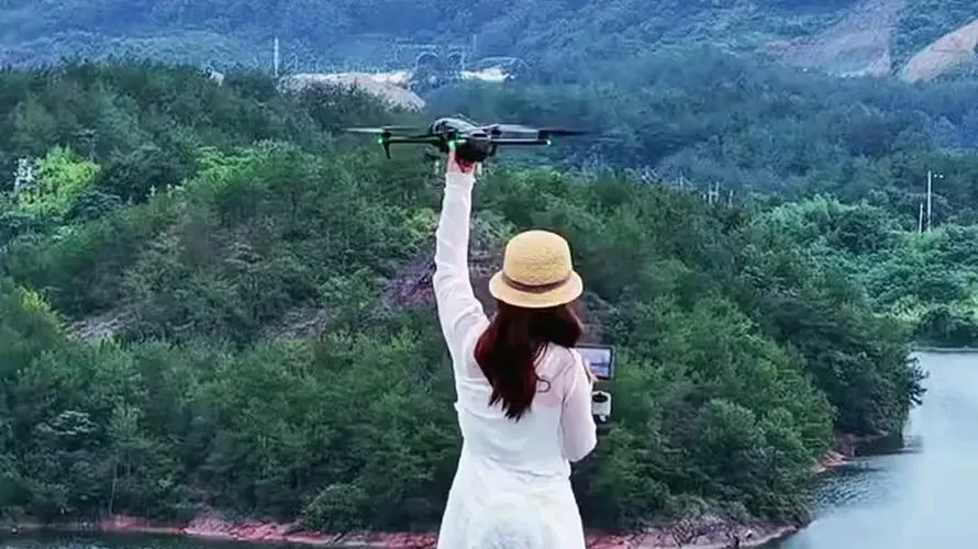 A traveler holding a drone and its controller