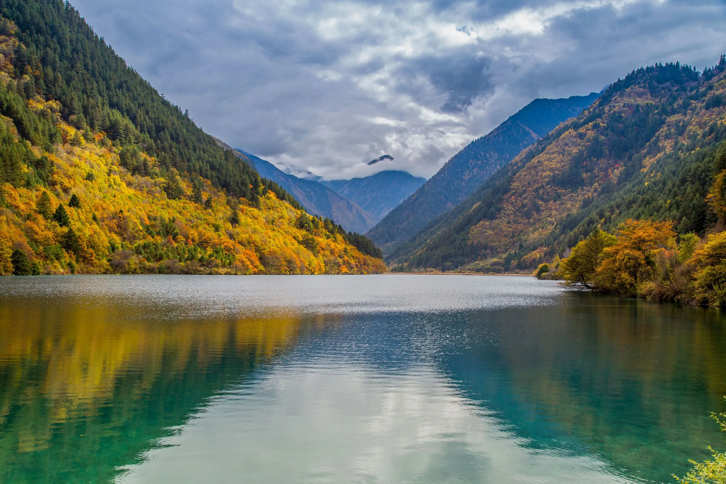 Autumn color mirrored in a spring-fed Jiuzhaigou lake