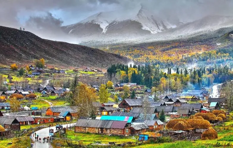 Baihaba border village with log houses and snow peaks
