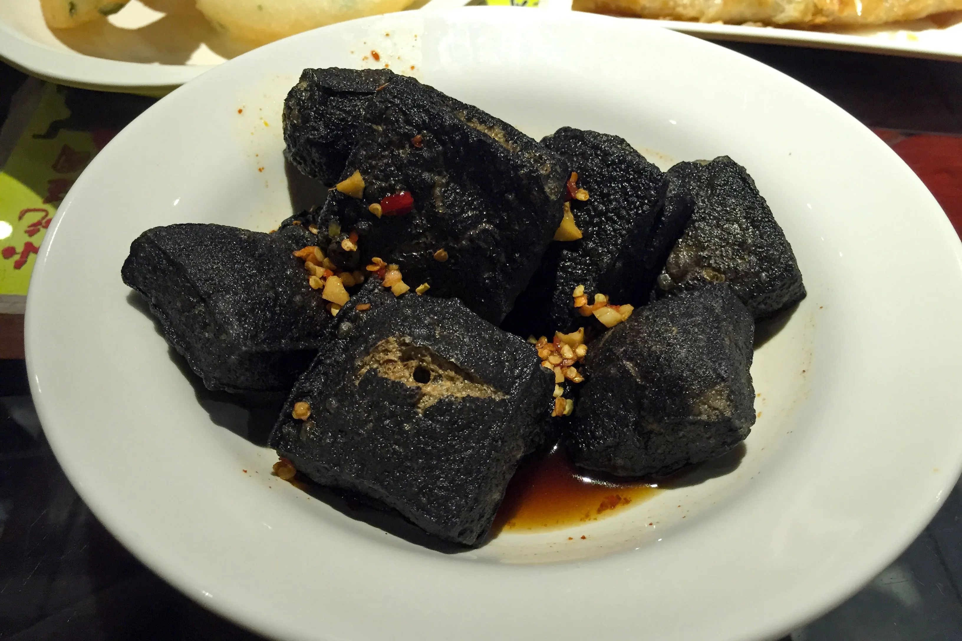 Changsha stinky tofu — black and crisp outside, white and fine inside