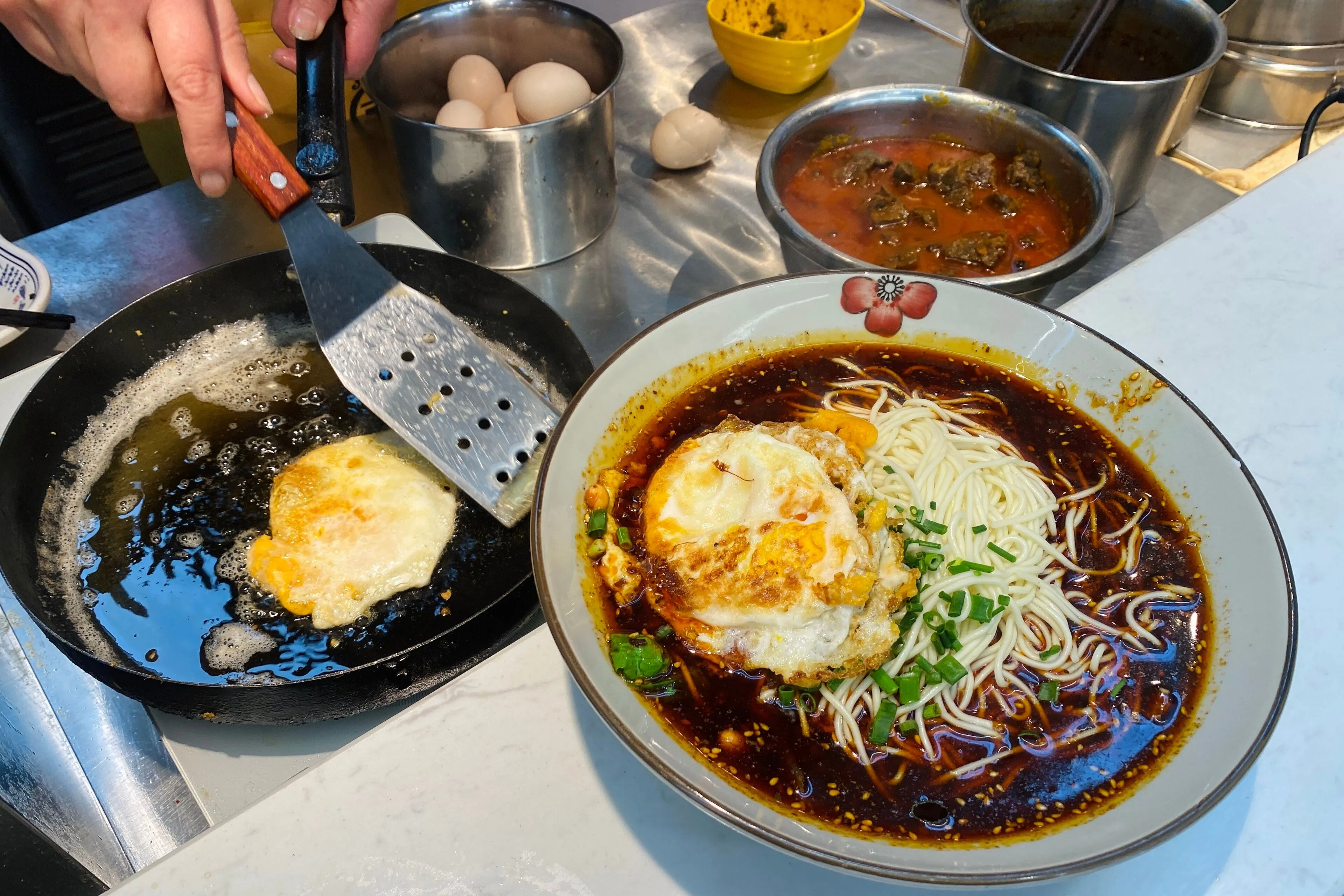 Chongqing xiaomian — a bowl of small noodles built on chilli oil and Sichuan pepper