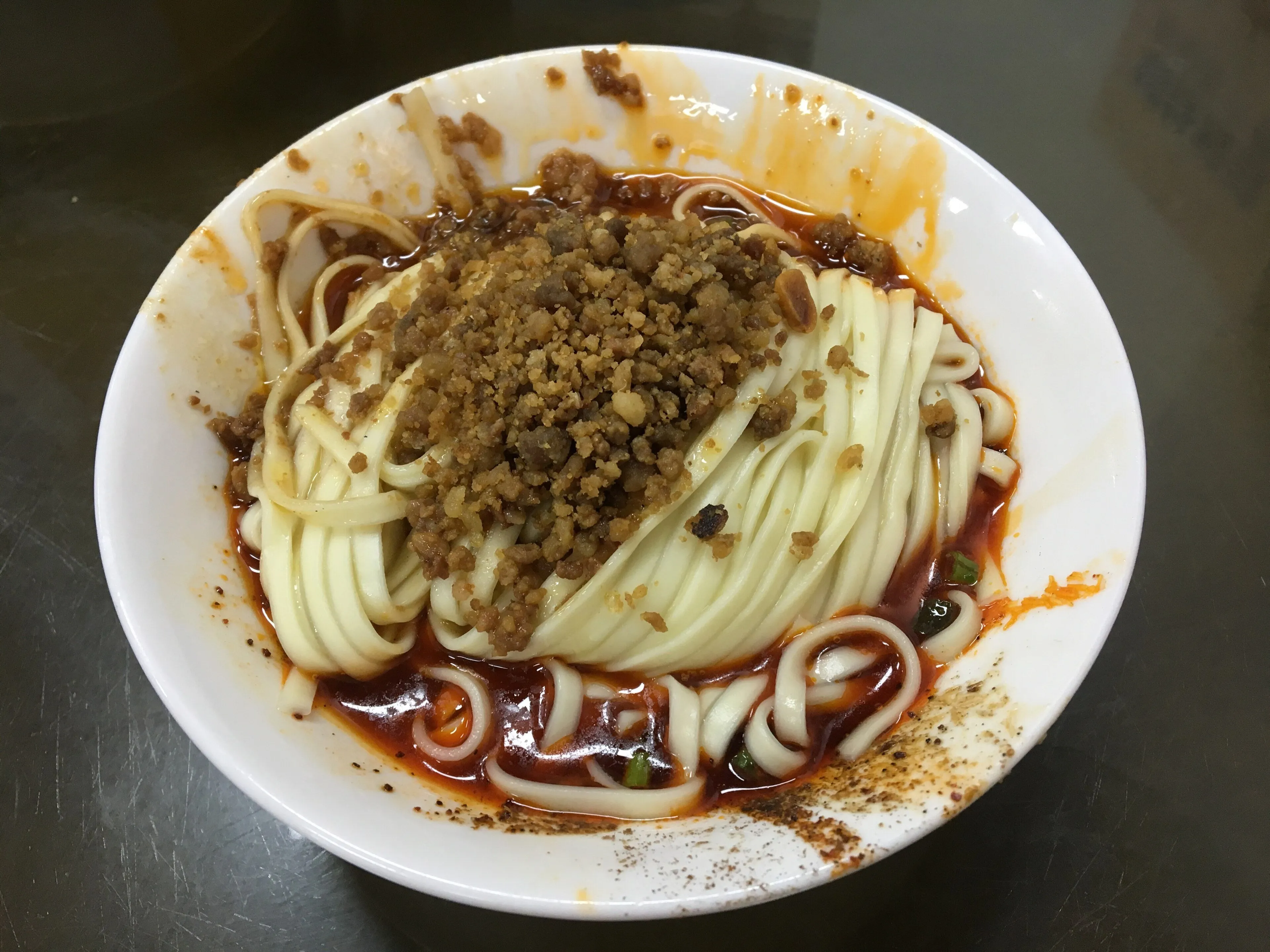 Dan dan noodles (dàndàn miàn) with sesame paste, red oil and a meat topping, Chengdu