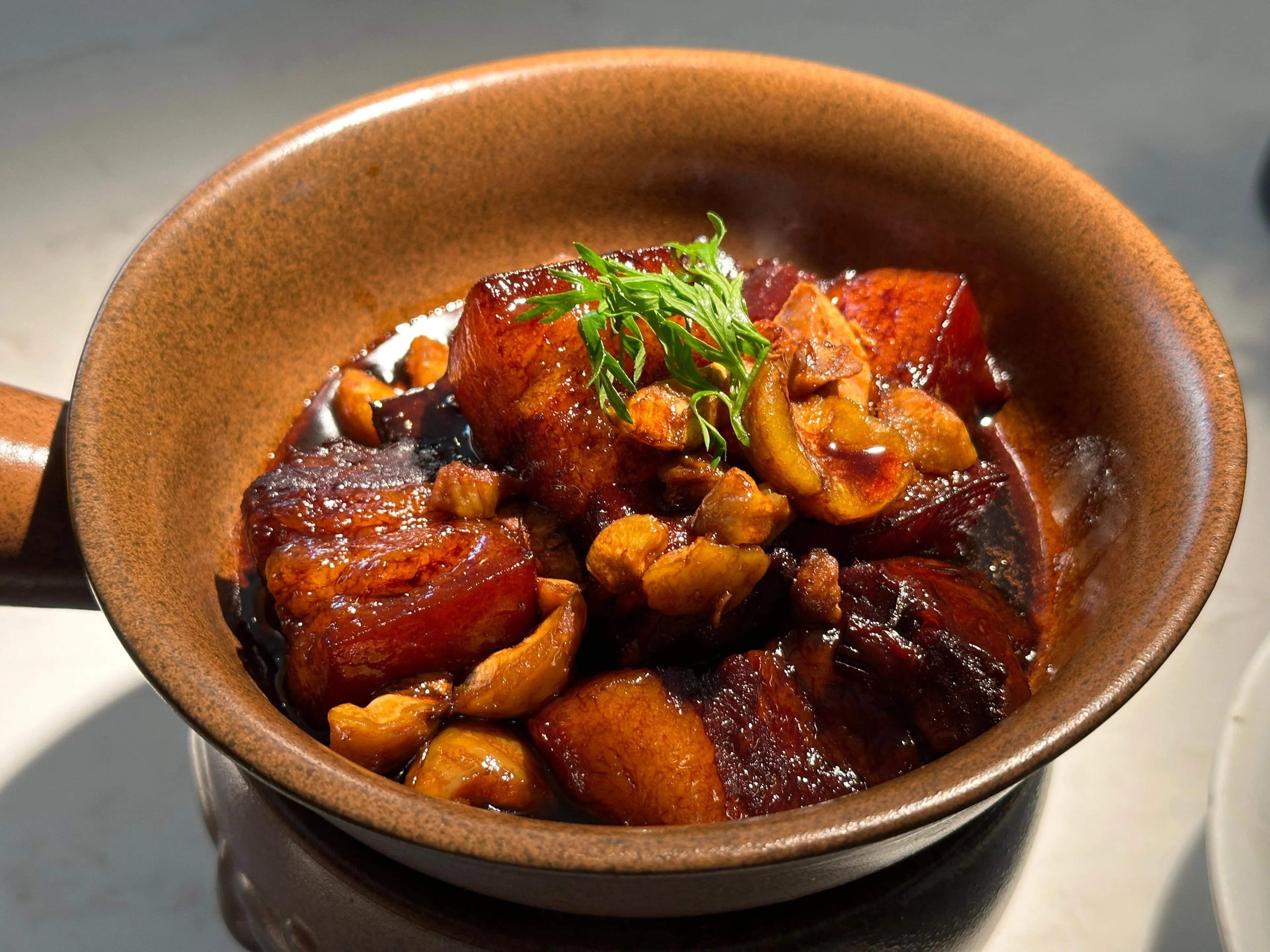Dongpo rou — a square of red-braised pork at exact tenderness, Hangzhou