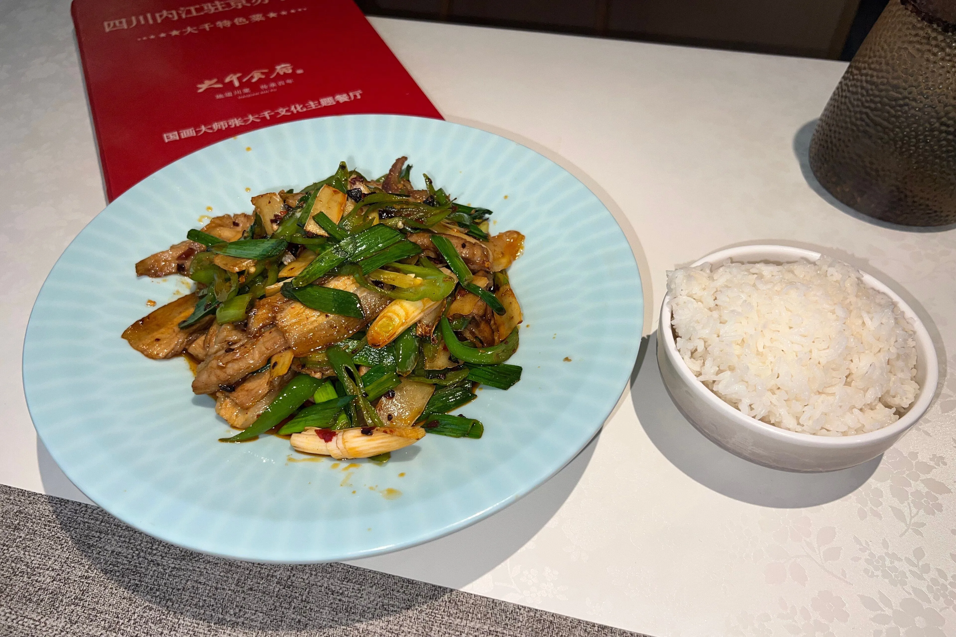 Twice-cooked pork (huíguō ròu) stir-fried with garlic shoots, Chengdu's home-cooking classic