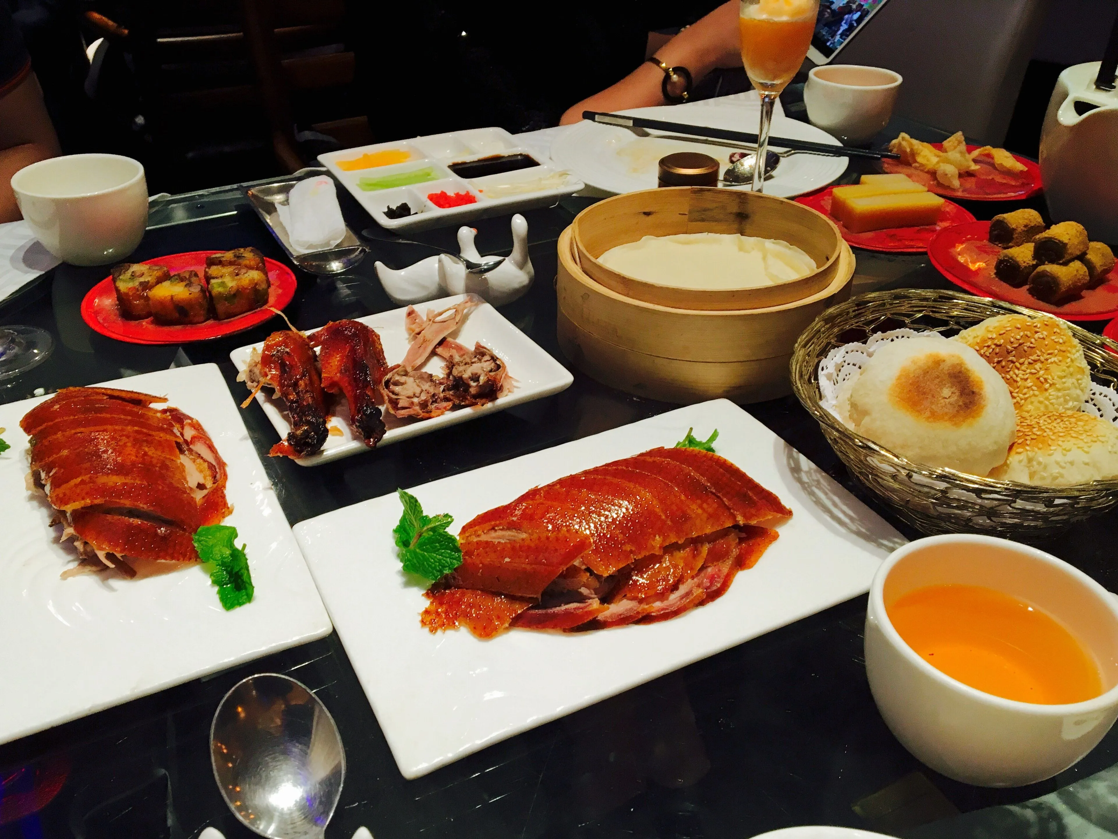 Peking duck carved with crisp skin, served with pancakes, scallion and sweet sauce, Beijing