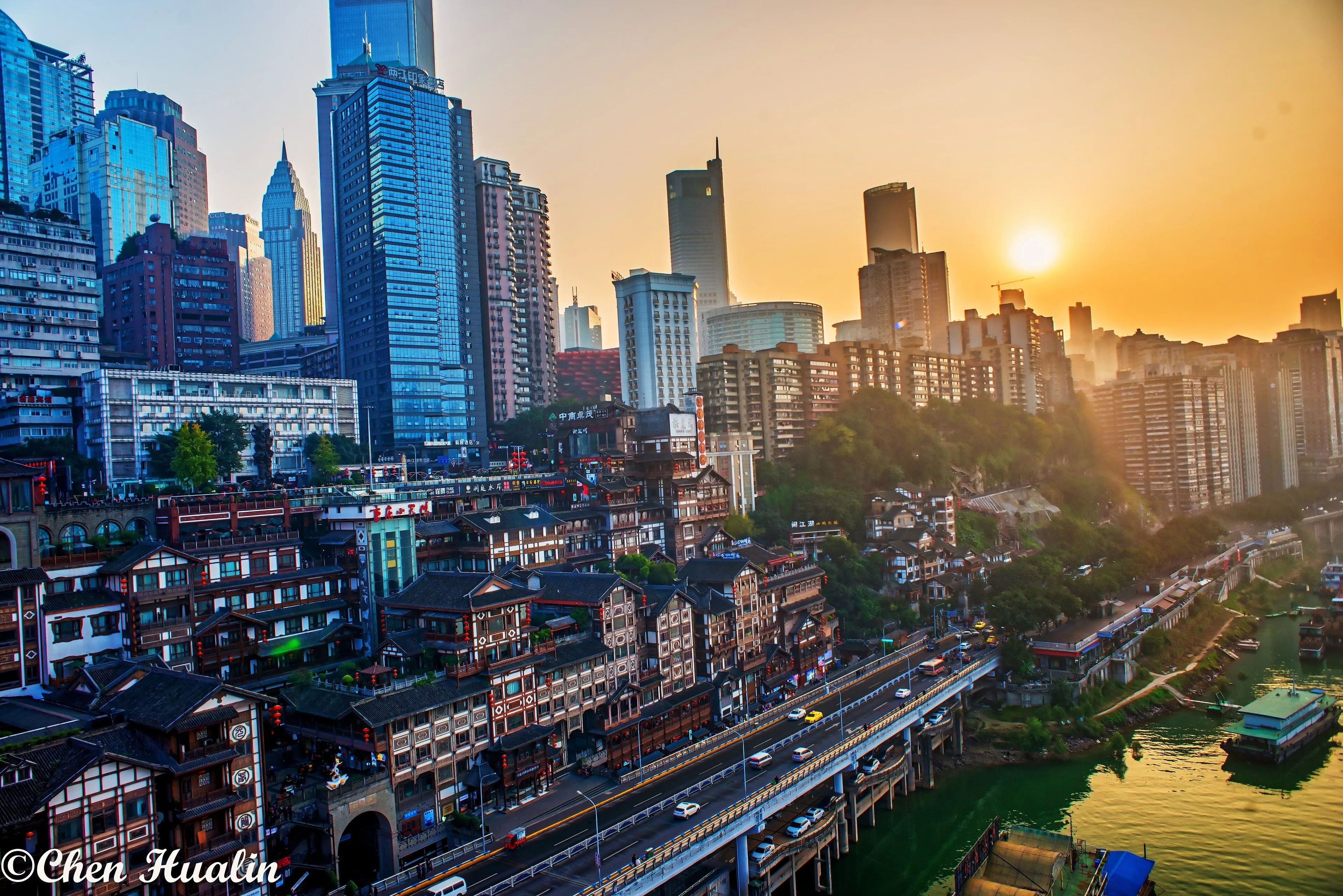 Hongyadong's stacked stilt buildings at dusk, before the lights come on