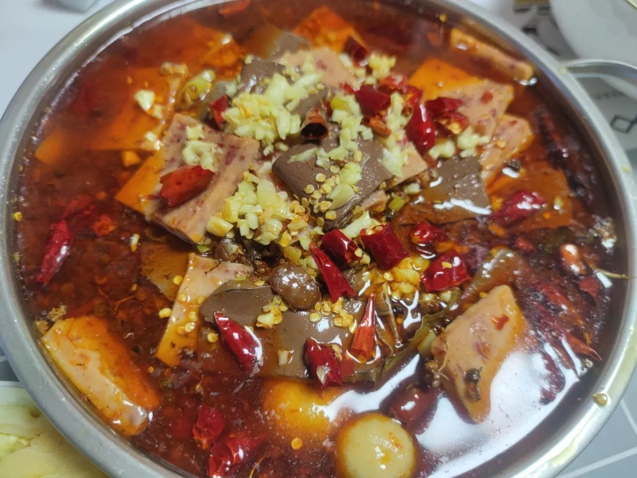 Maoxuewang — duck blood curd with tripe and luncheon meat in fiery broth, Chongqing