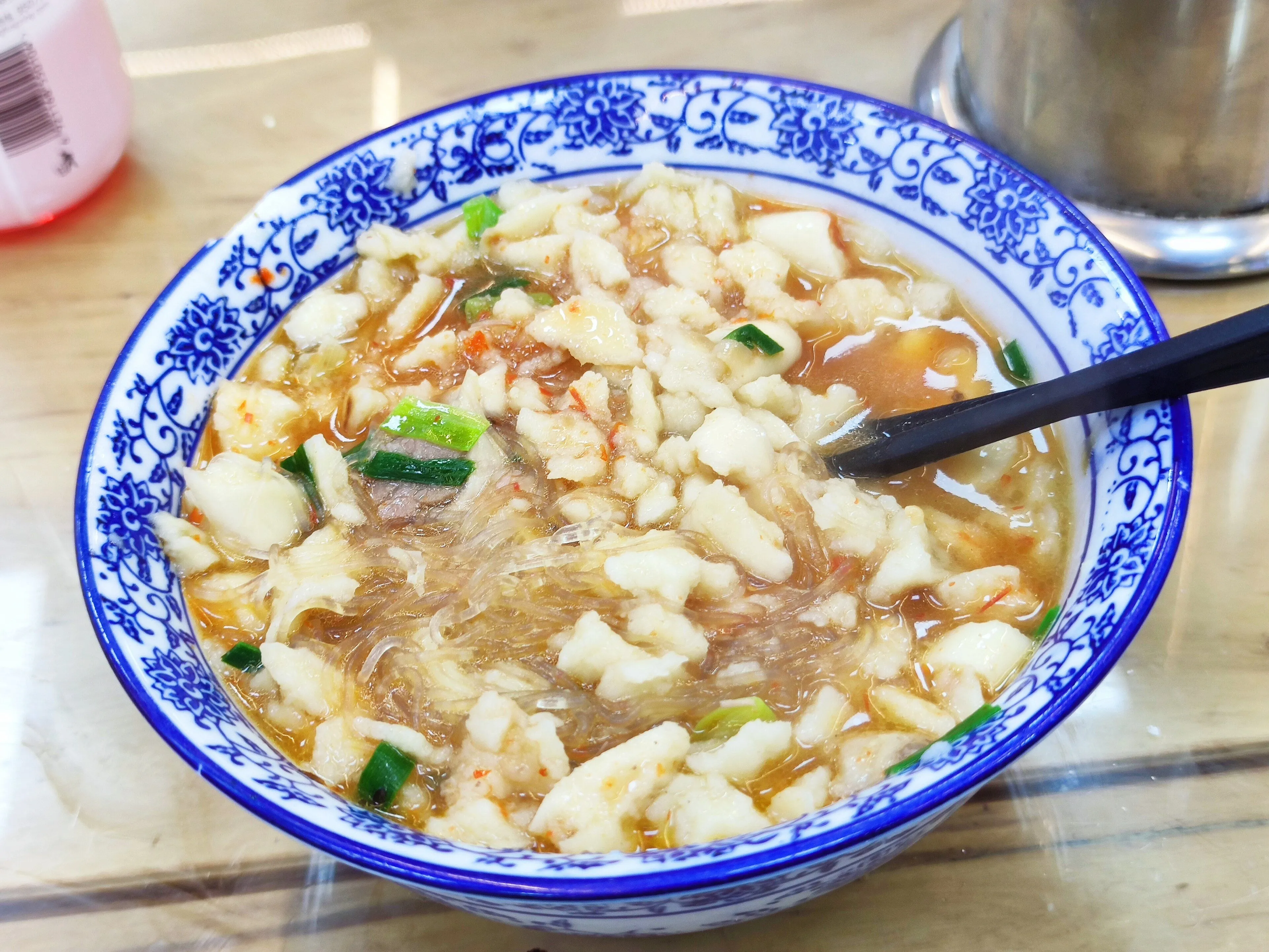 Yangrou paomo — mutton soup poured over hand-torn bread, Xi'an