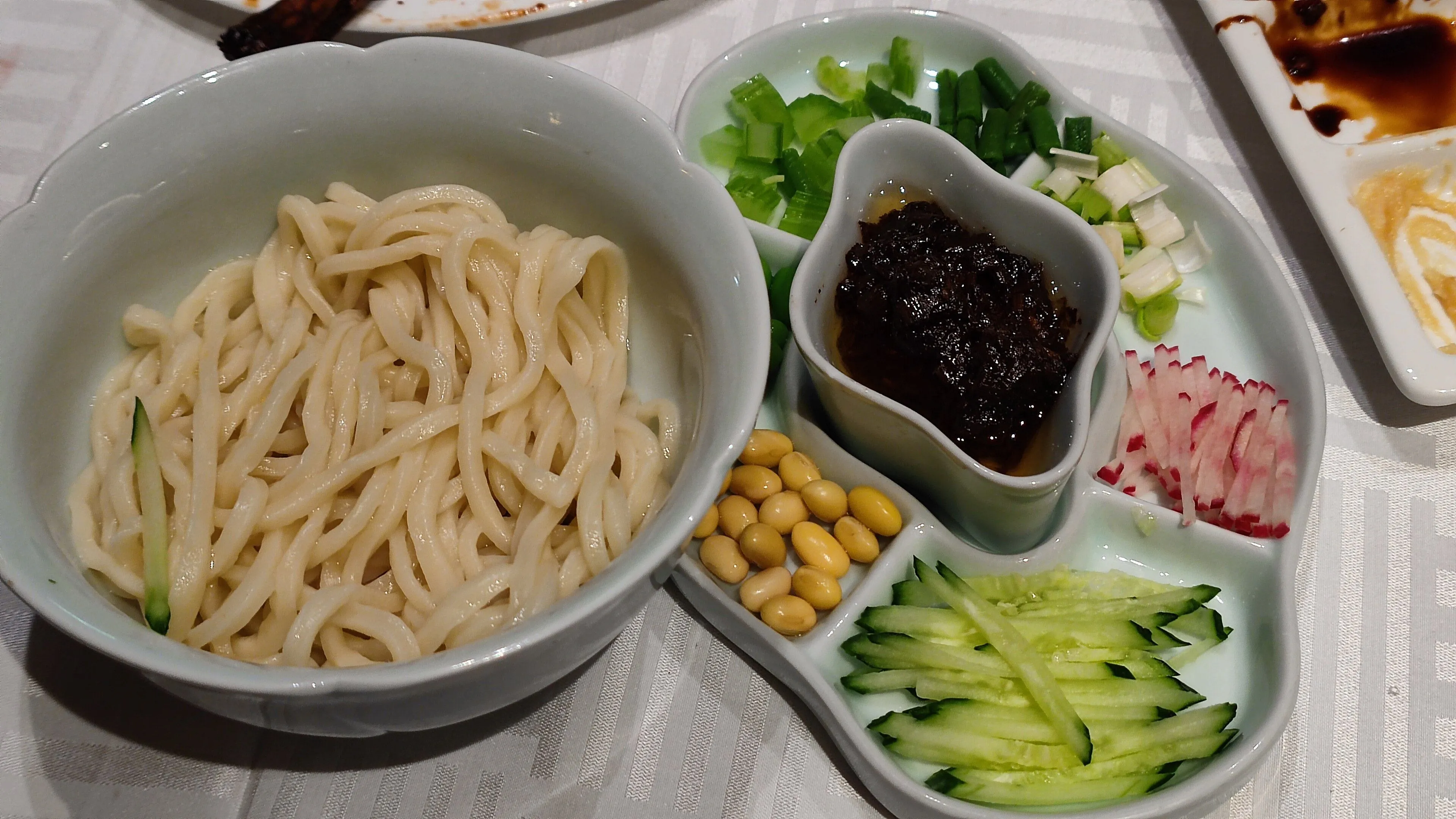 Zhajiangmian — Beijing noodles with fried bean sauce and separate vegetable toppings