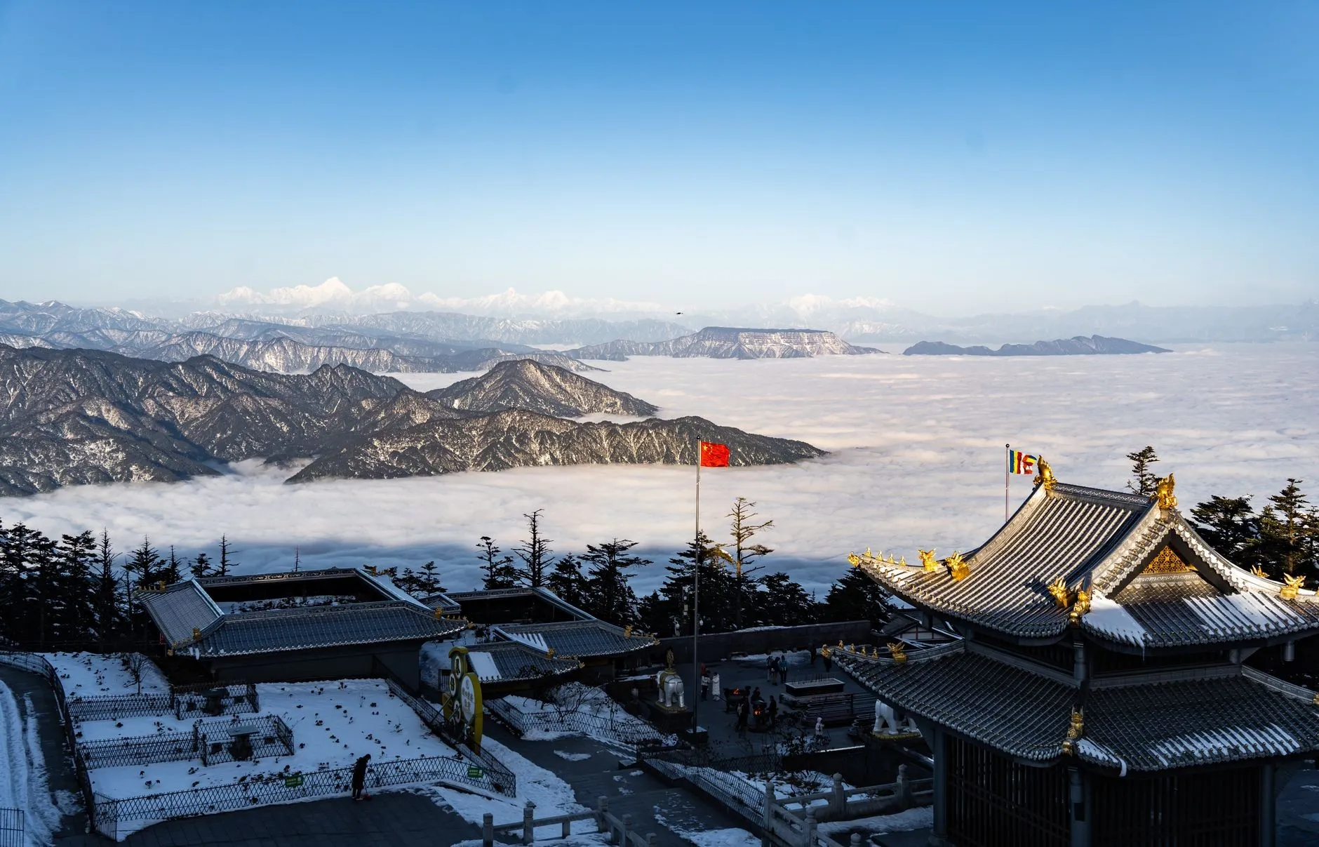 Emeishan Golden Summit temples under snow with sea of clouds