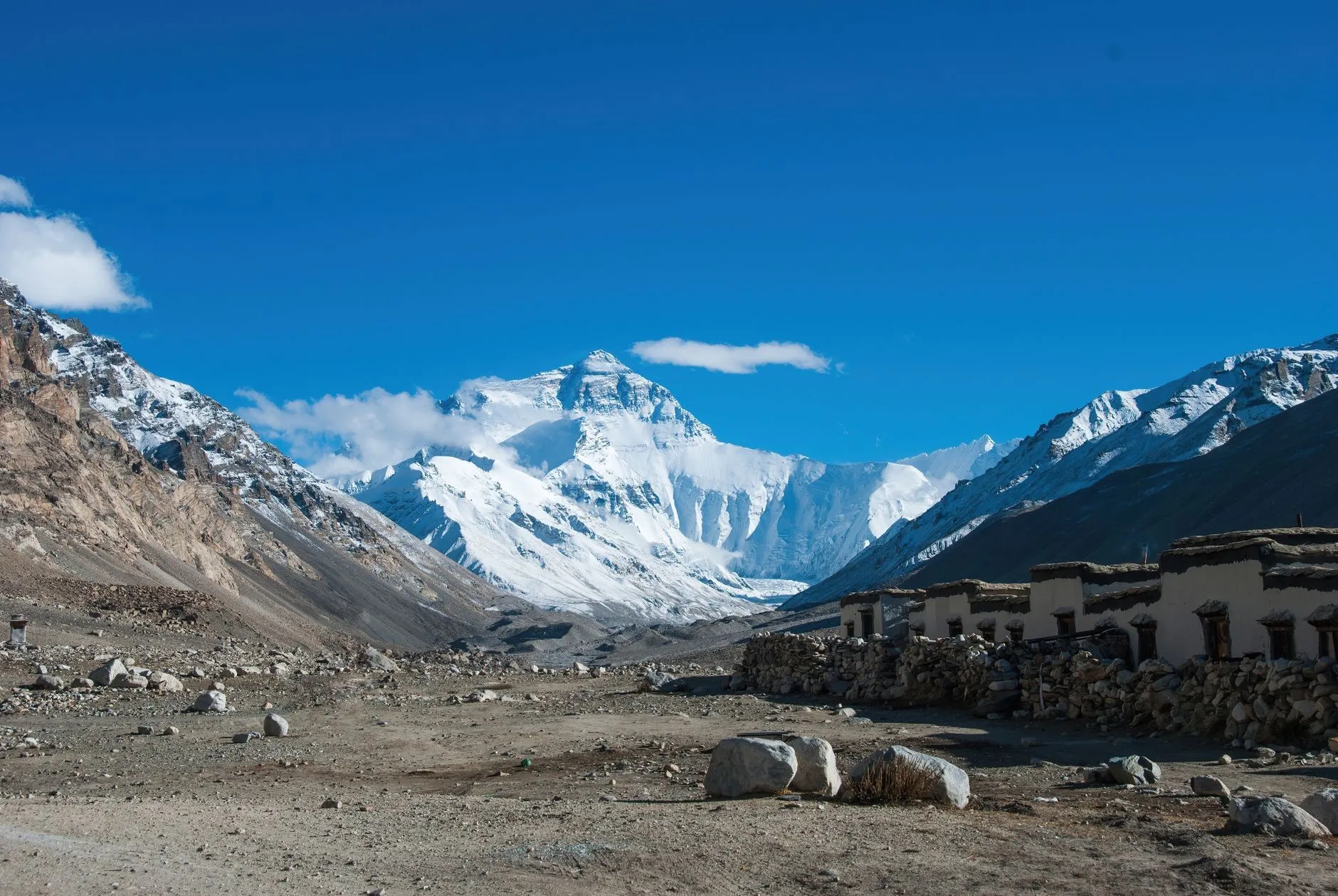 Everest region glacier peaks and stone village in the valley