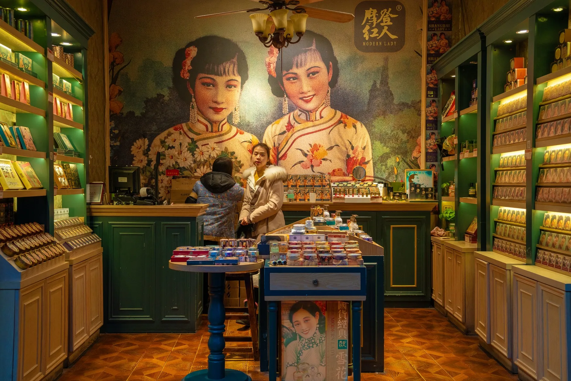 A shop with a 1930s Shanghai-style advertising mural, selling gift-boxed tea