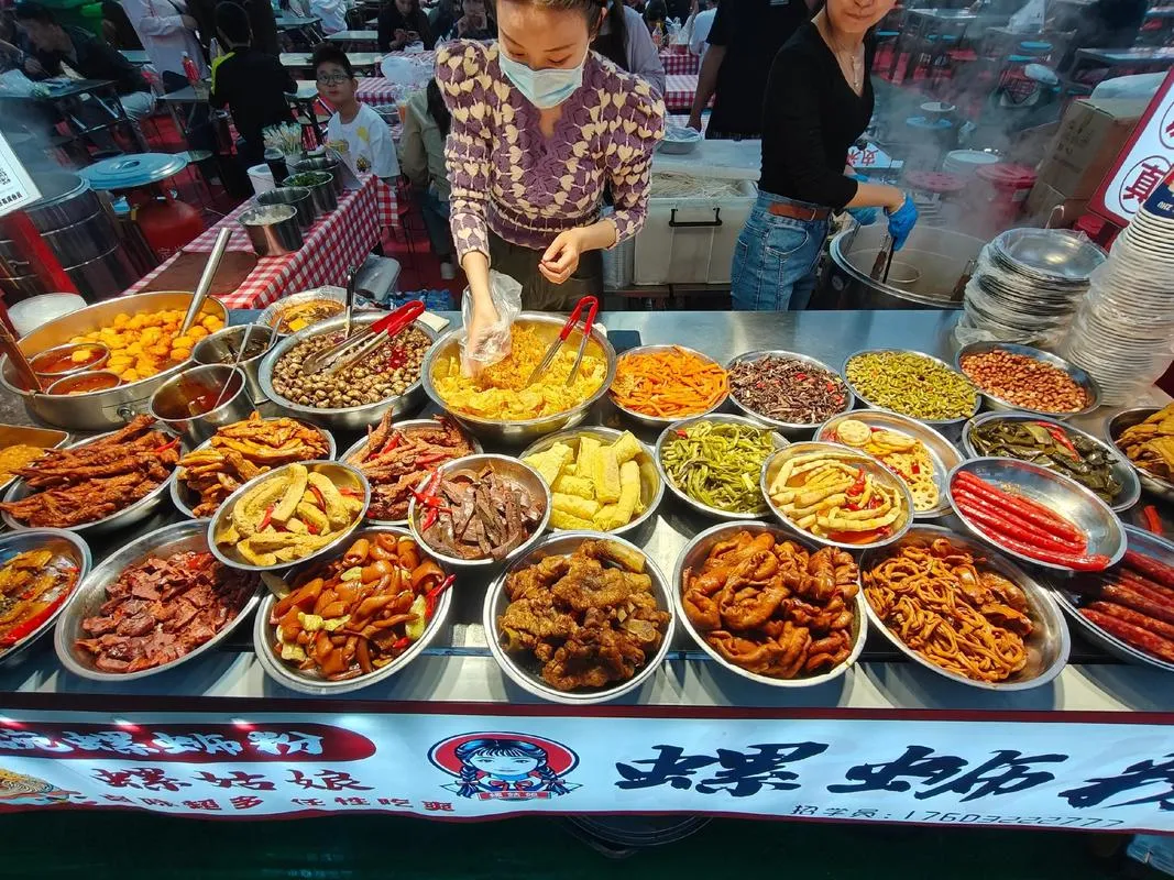 China Night Market — a bustling night market lit with warm lights, food stalls lined up on both sides