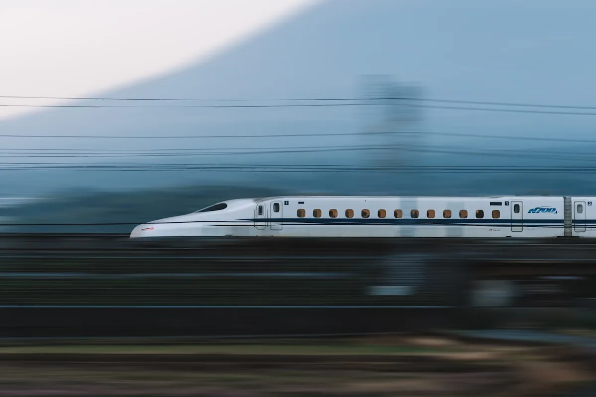 High-speed train passing through mountainous Chinese countryside