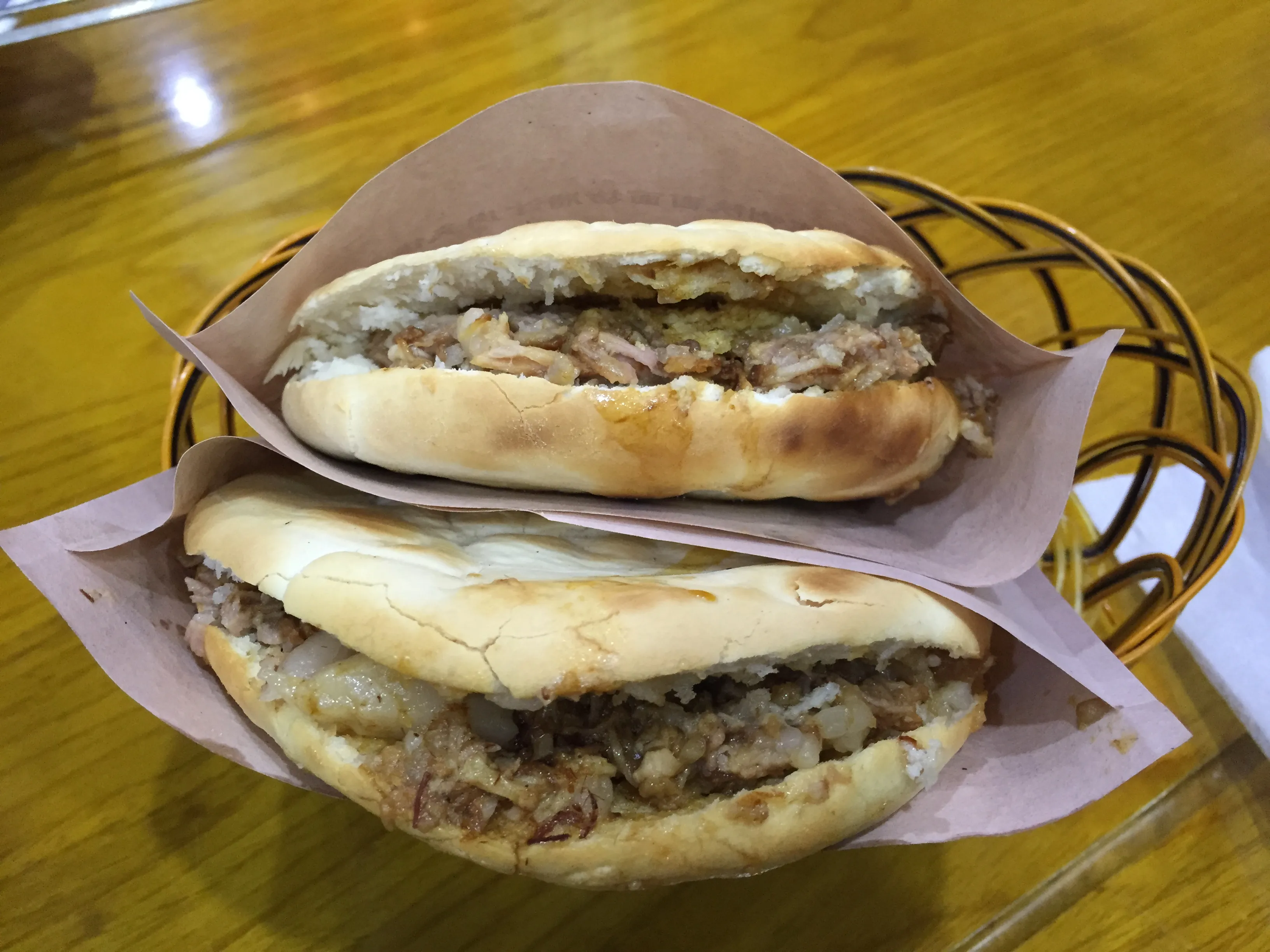 Authentic roujiamo — chopped braised pork stuffed inside crispy baked flatbread